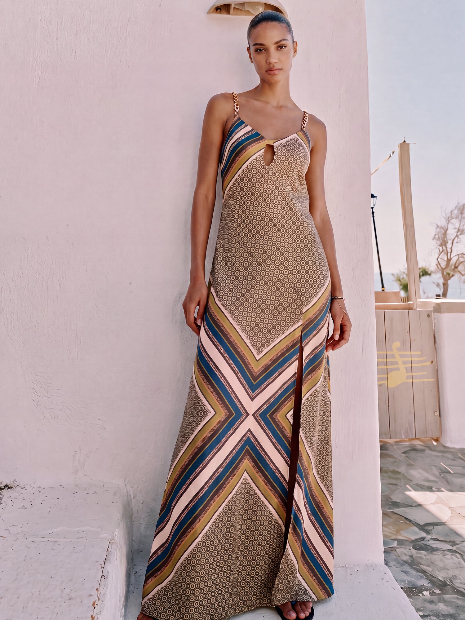slip dress with slit Slinky FIT Raquelle is wearing a Small Height Blue Floral Slip Dress with